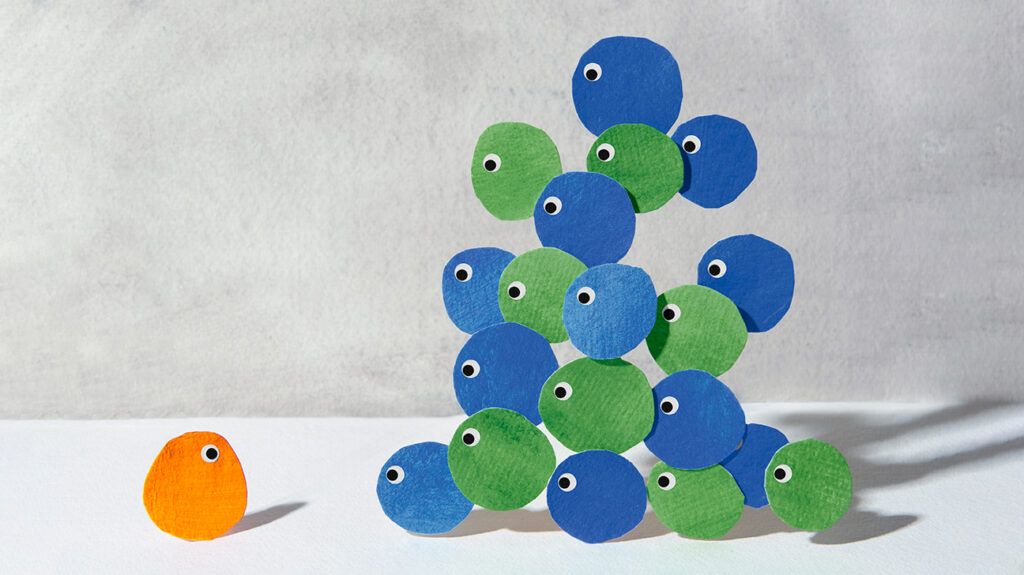 handmade colored crafts of felt circles with googly eyes symbolizing workplace bullying