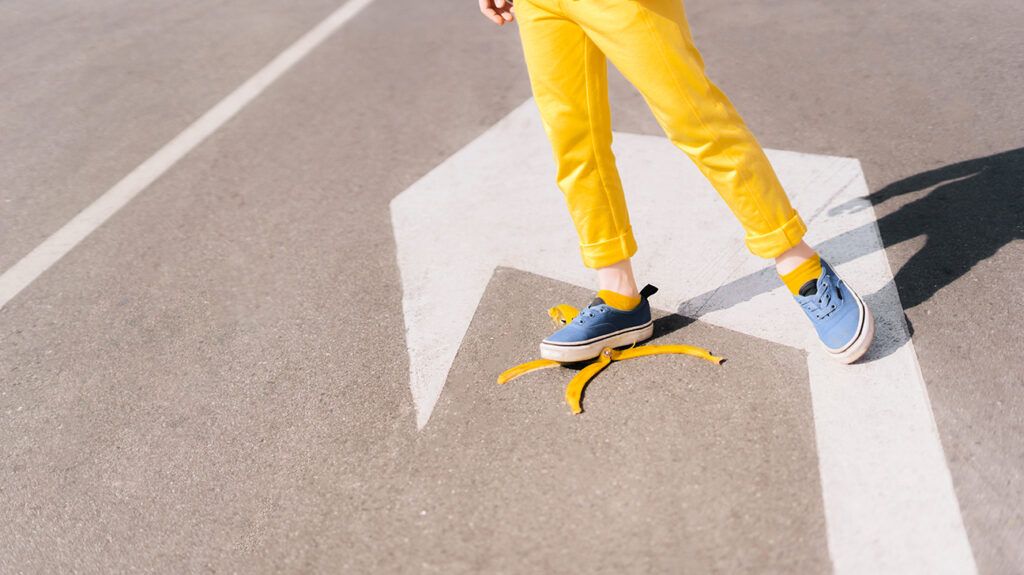 Stepping on a banana peel, symbolic of the Freudian slip
