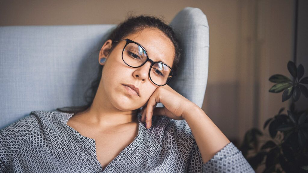 Woman whose spouse abandoned her, lost in thought