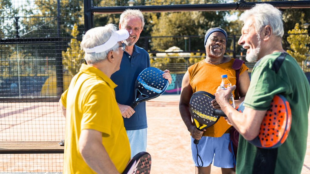 group of friends playing pickleball