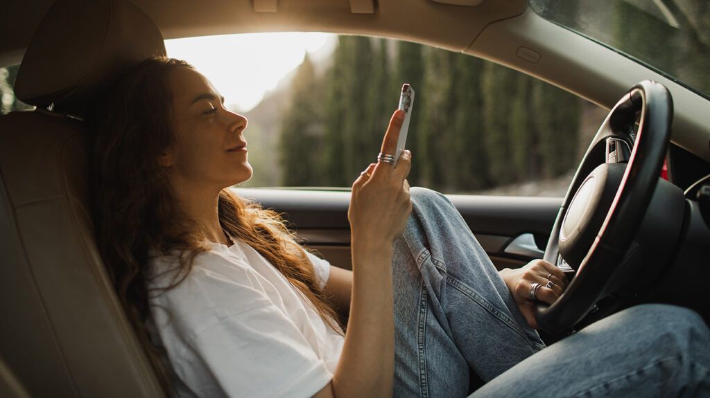 a woman on her phone while driving