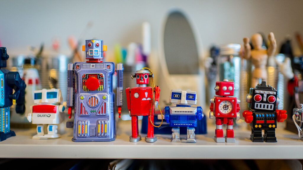 a row of retro tiny toy robot collectibles