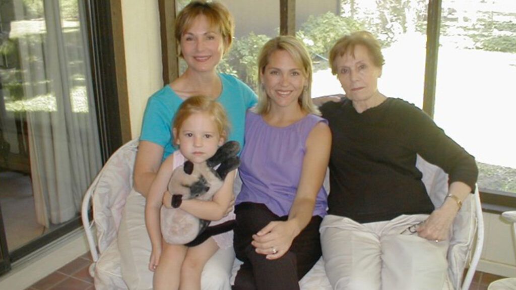 Virginia Moore, Dianne Slade, Valerie Wright, and Emery Wright sitting together on a couch.