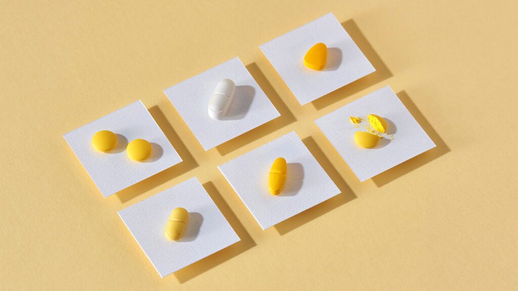 Small square cards with pills on each that represent hypertension treatment