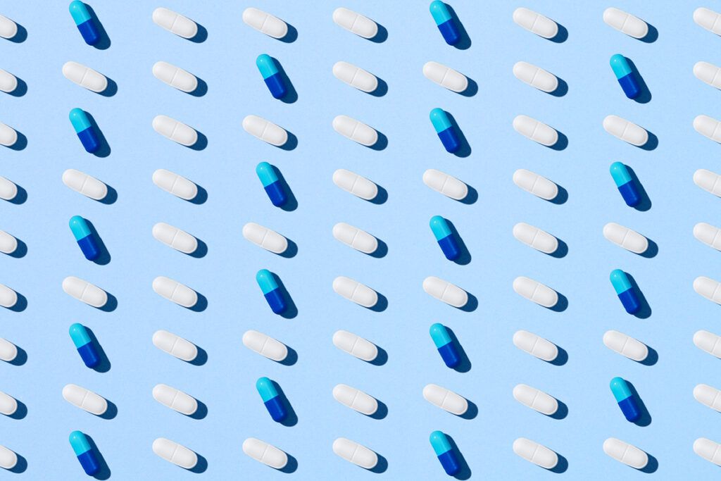 A grid of pills laid out evenly on a blue background