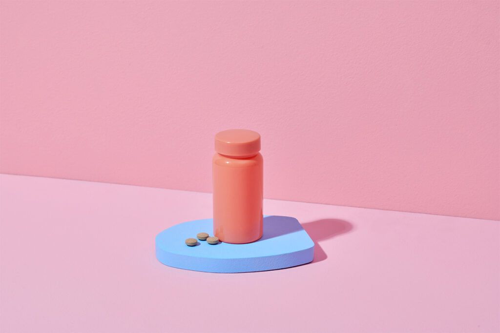 A pill bottle on a table.
