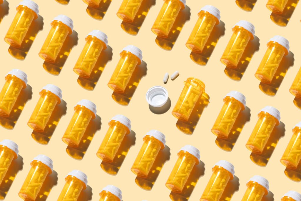 An image of several rows of pill bottles.