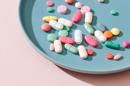 A tray filled with colorful pills