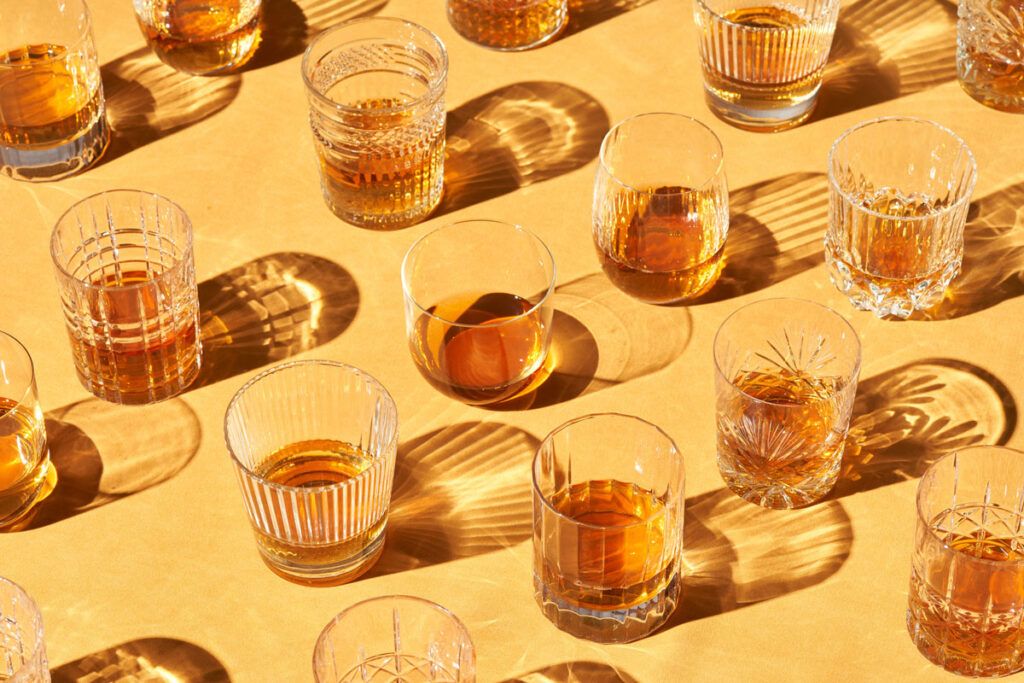Whiskey glasses lined up 
