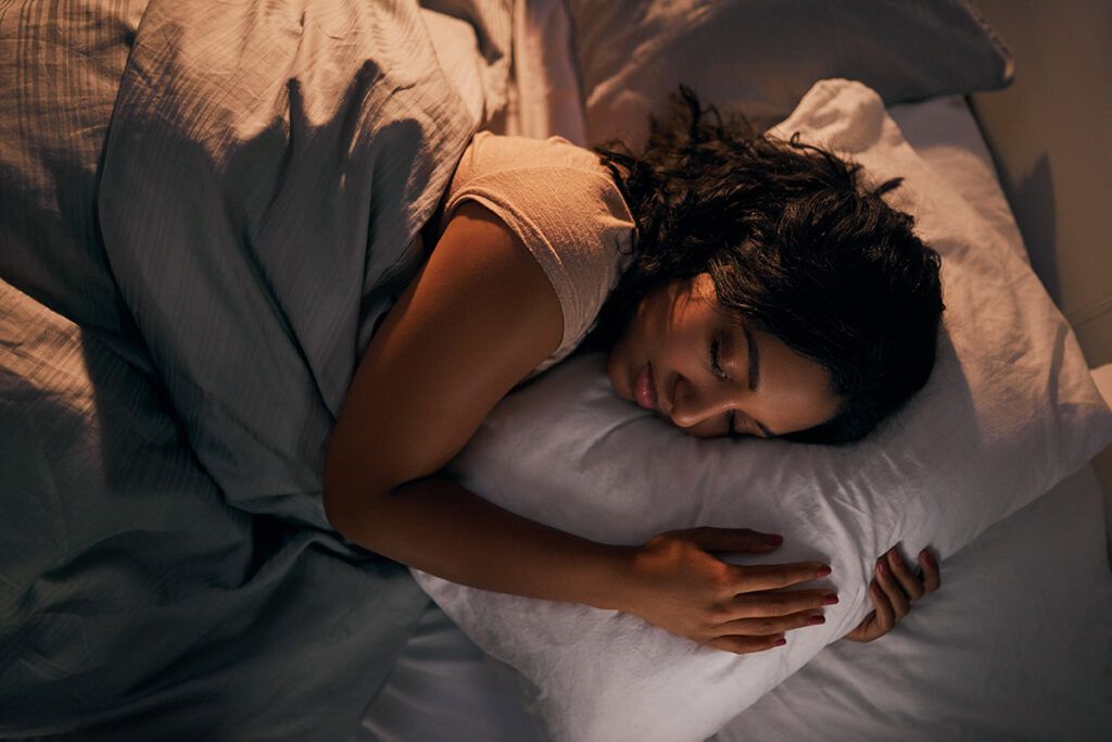 Woman with bipolar disorder sleeping in bed