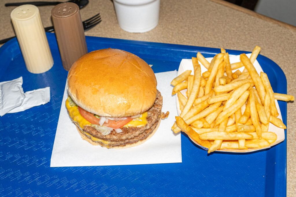 A burger and fries, two examples of foods to avoid for a hiatal hernia