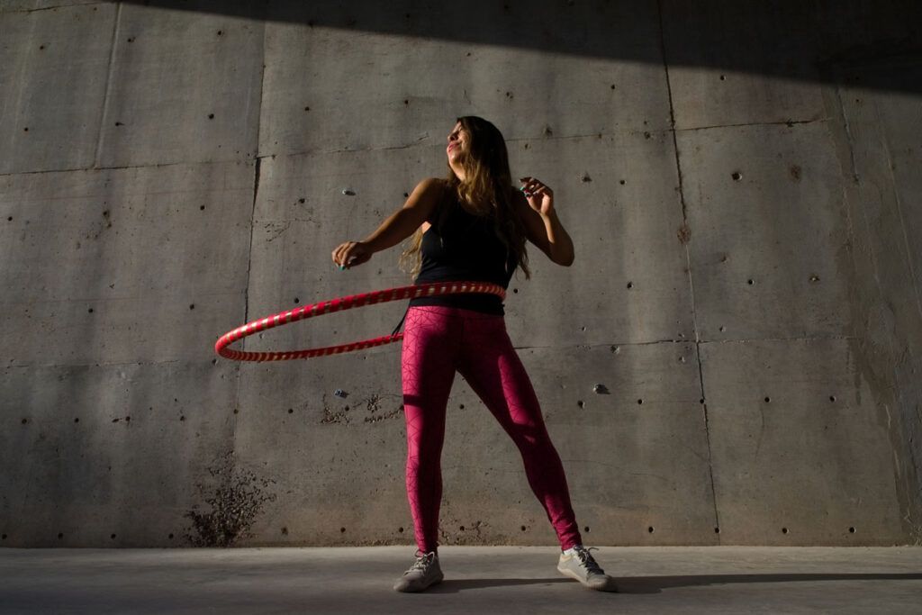 Woman hula hooping to lose weight while on birth control