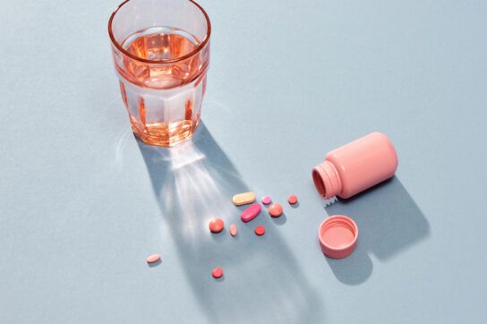 Medicine or Pill in the Pill Box and a Glass of Water
