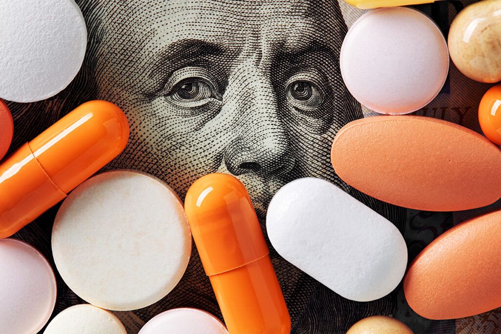 Pills and capsules covering a dollar bill as we look at the most expensive drugs