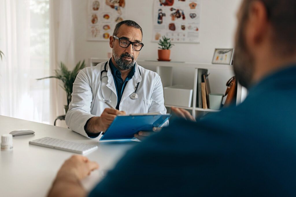 Adult male talking with doctor about prescription medications to increase testosterone