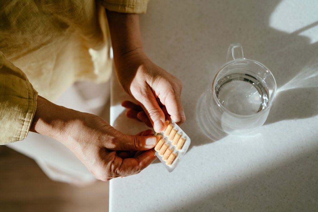 Person holding a packet of the medication cymbalta, for nerve pain.