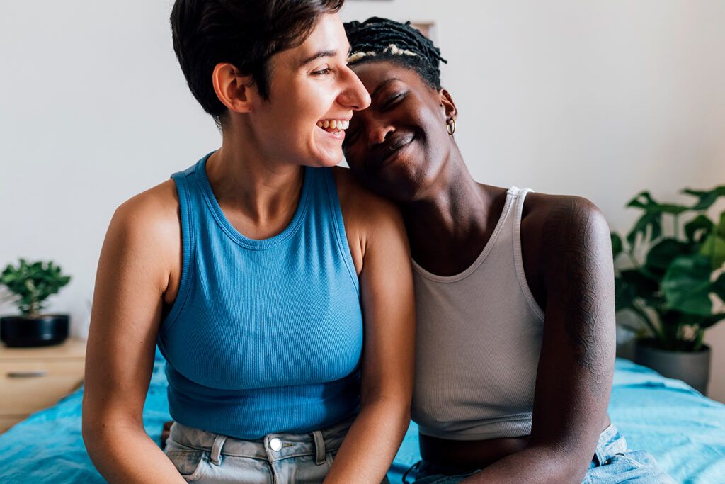 A young couple smiling together after starting anxiety medication.