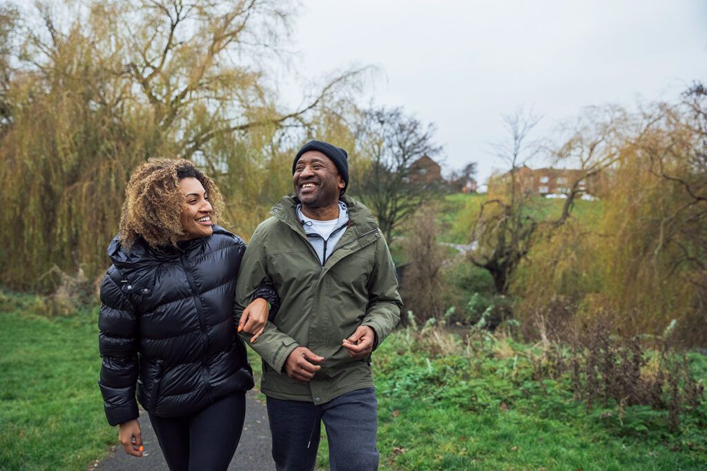 Two adults on a walk to depict the question 'does blood pressure increase with age?'