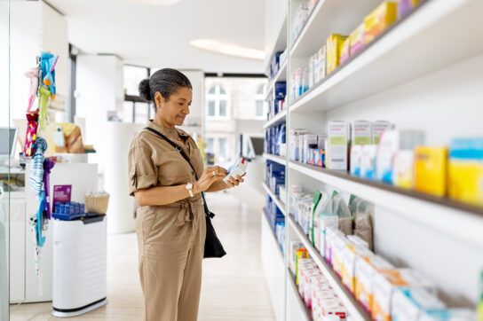 Adult woman checking label on a medication package