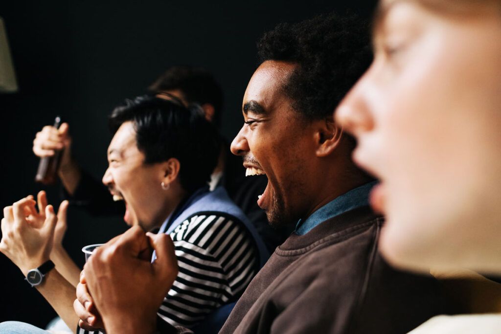 Men cheering energetically after taking natural remedies for fatigue