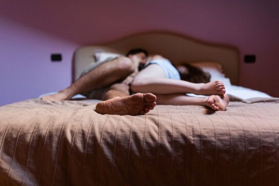 A couple having intimacy in bed