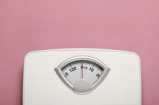 Body weight scale with pink background
