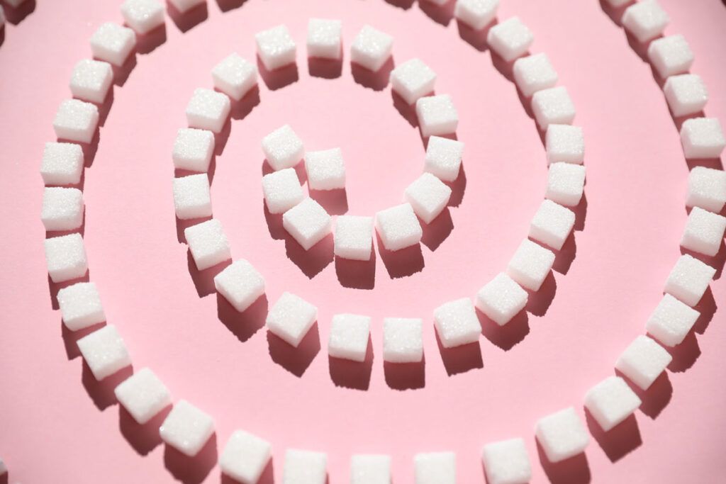 Cubes of sugar laid out in the shape of a spiral.