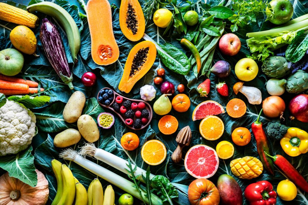 A variety of colorful fruits and vegetables shown from above.