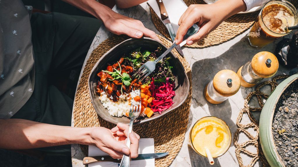 Some people sharing a healthy meal for a GLP-1 diet.