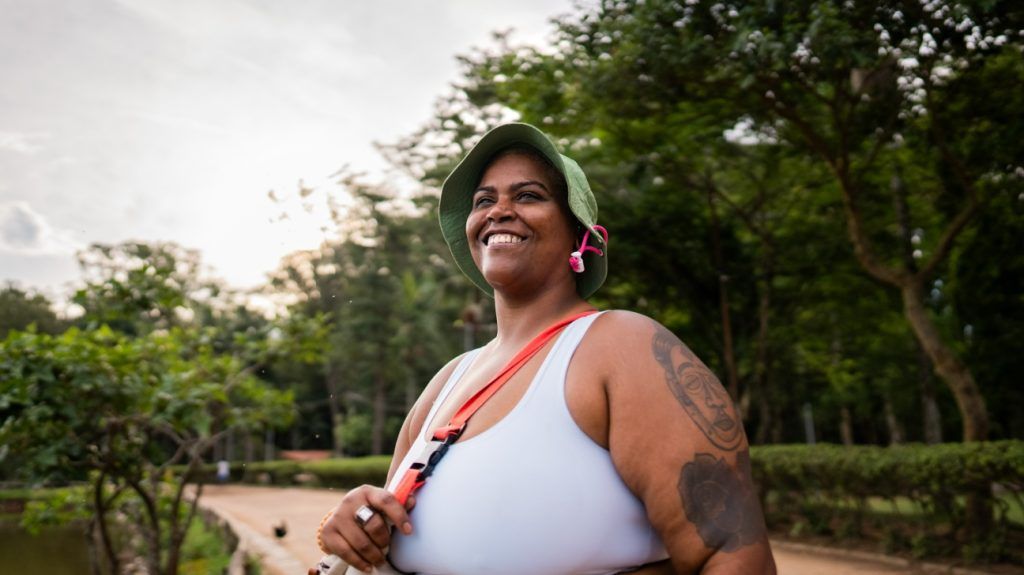 A plus-size woman living a healthy lifestyle in the park.